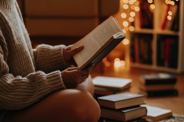 A person reading on the floor.
